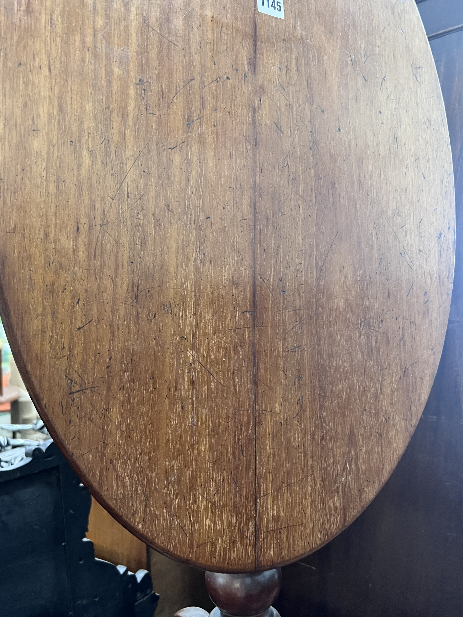 A Victorian spiral stem circular mahogany wine table, diameter 50cm, height 71cm, together with a Victorian oval mahogany tilt top tripod table